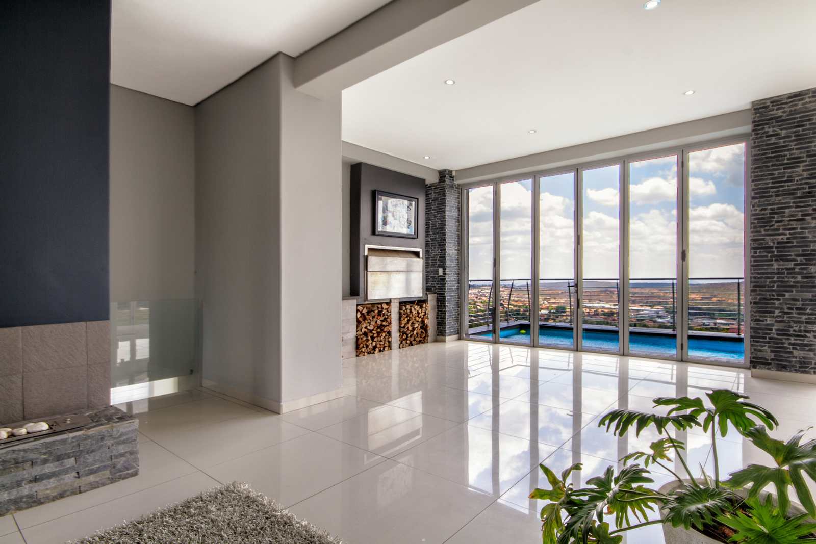 A living space opening onto a pool and garden
