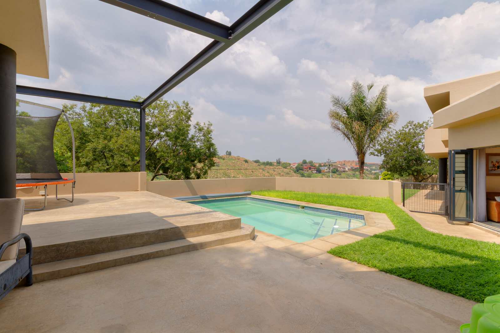A poolside entertainment area overlooking the West Rand