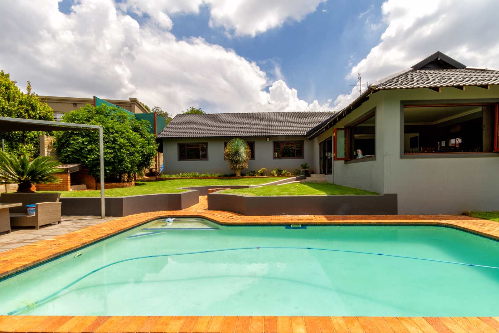 A established garden and pool at a Noordheuwel home