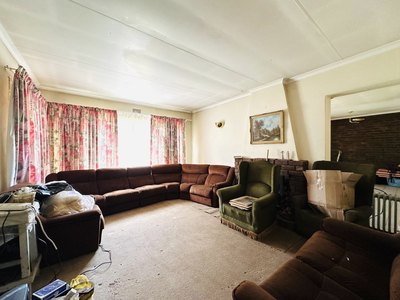 118 Buiten Street — carpeted living room with fireplace